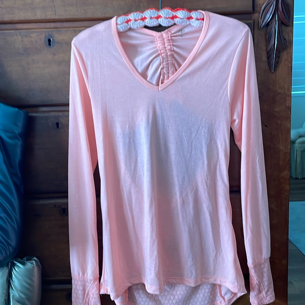 A peach long sleeve top with an open back, very cute and stylish